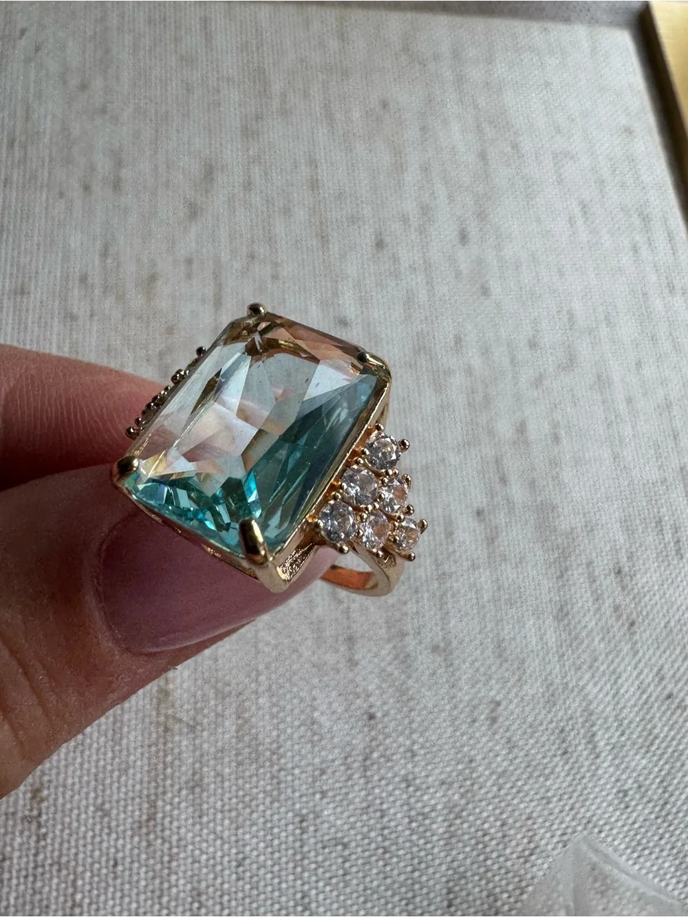 Stunning gold tone ring with blue crystal